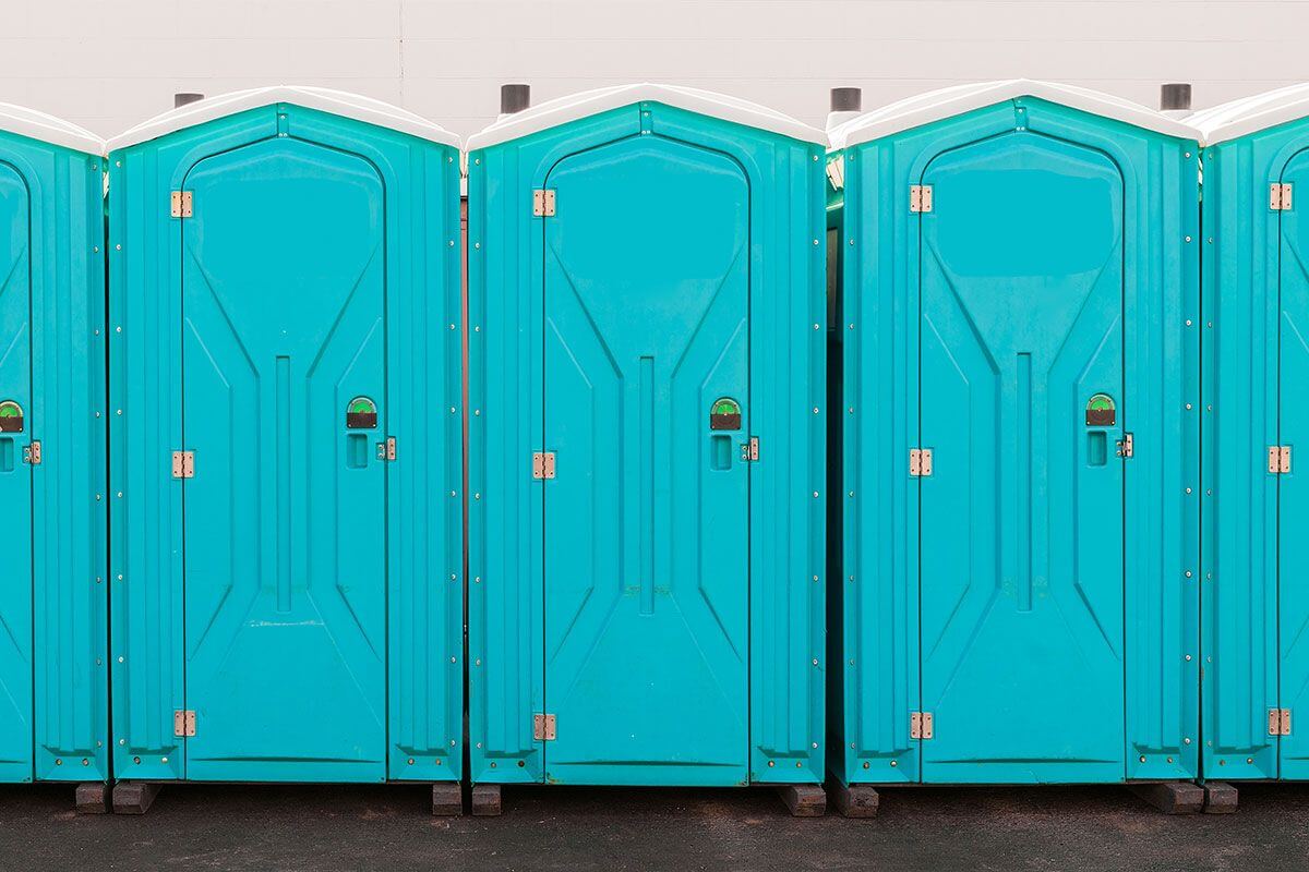 Industrial portable restroom units at a plant in Chowchilla, California